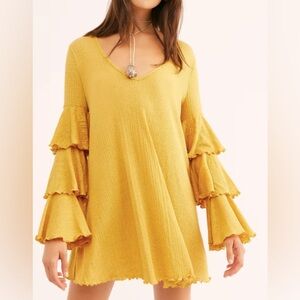 FP Beach yellow dress with ruffle sleeves.  Size M.